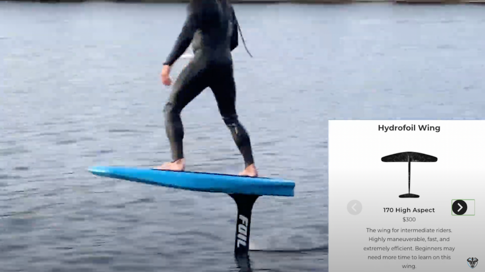 a man riding a blue foil board on open water